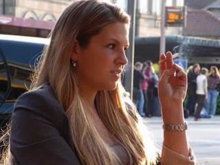 Beautiful Blonde Smoker On Outdoor Patio