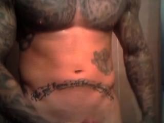 Muscle Tatted Hunk Jerks Off
